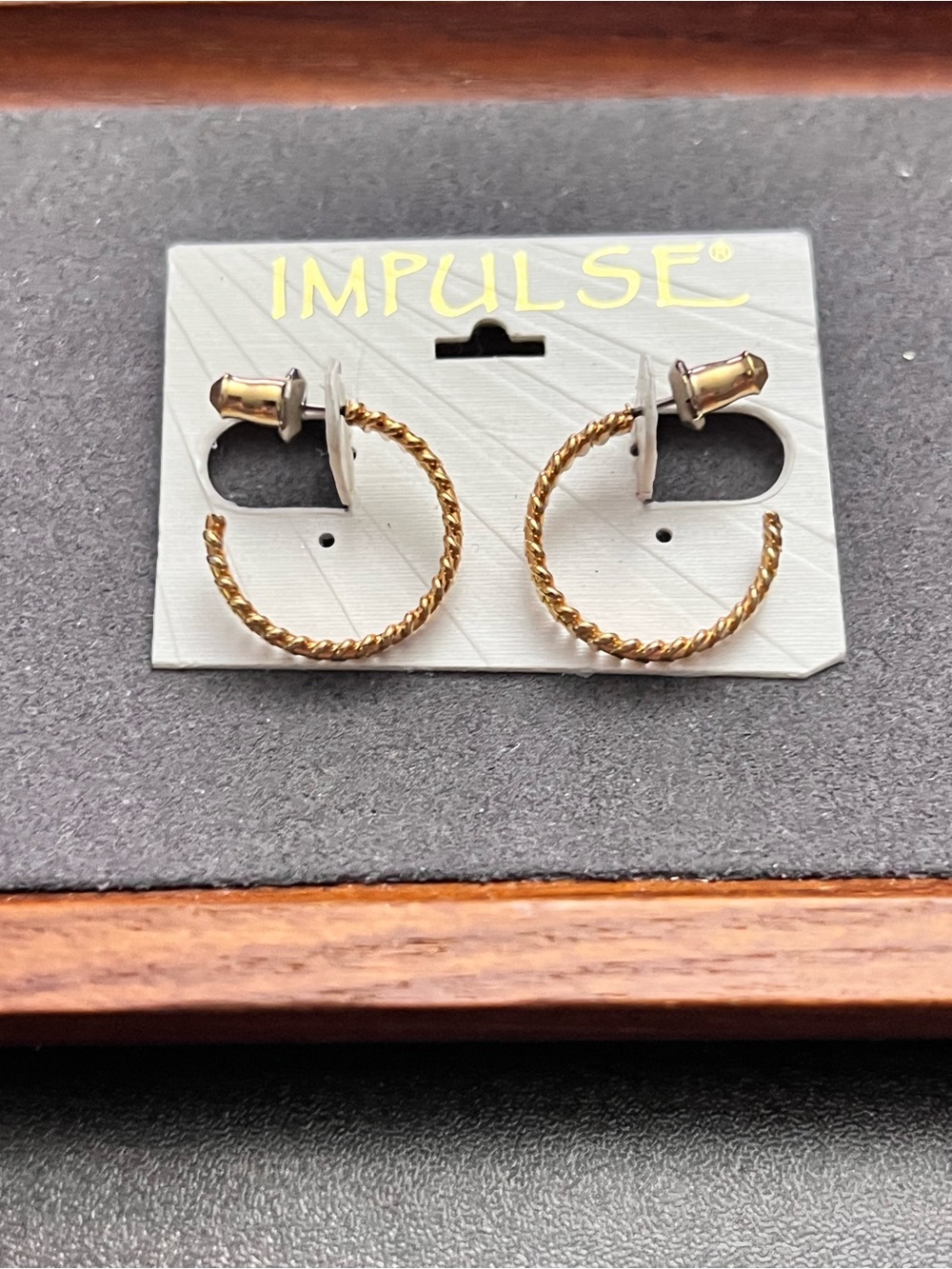 Twisted Hoop Earrings in Gold